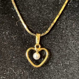 Floating Pearl in a little Heart of Gold Cage on an 80's Gold Electroplate 18"